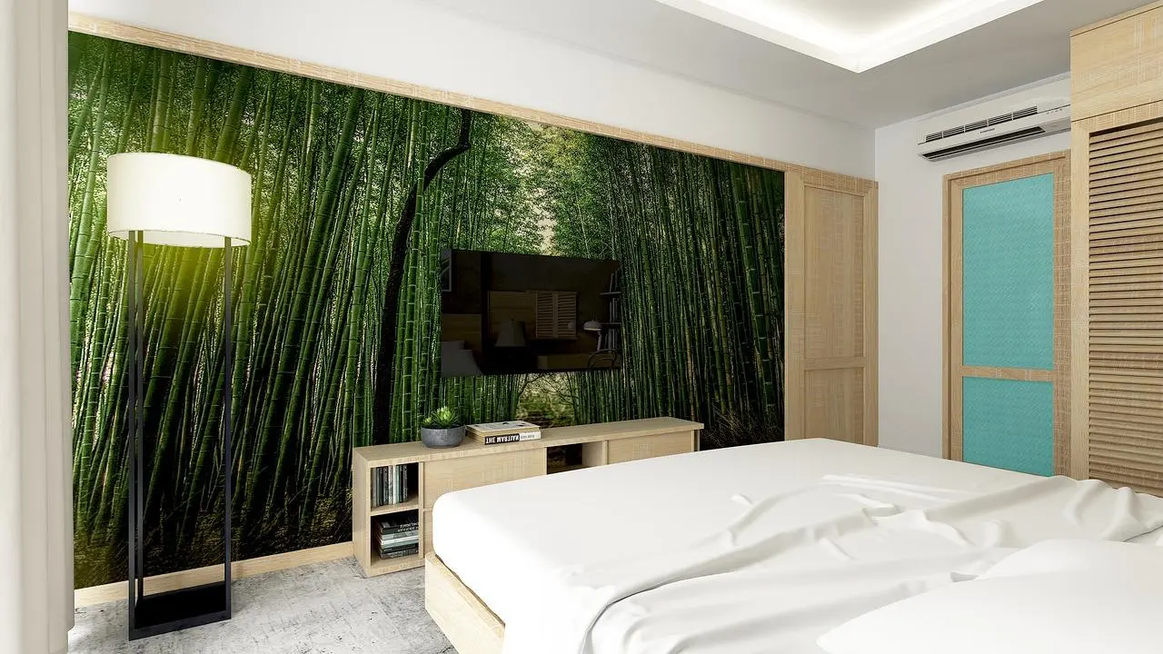 Bedroom with a concrete floor, a bamboo forest wall mural and a floor lamp