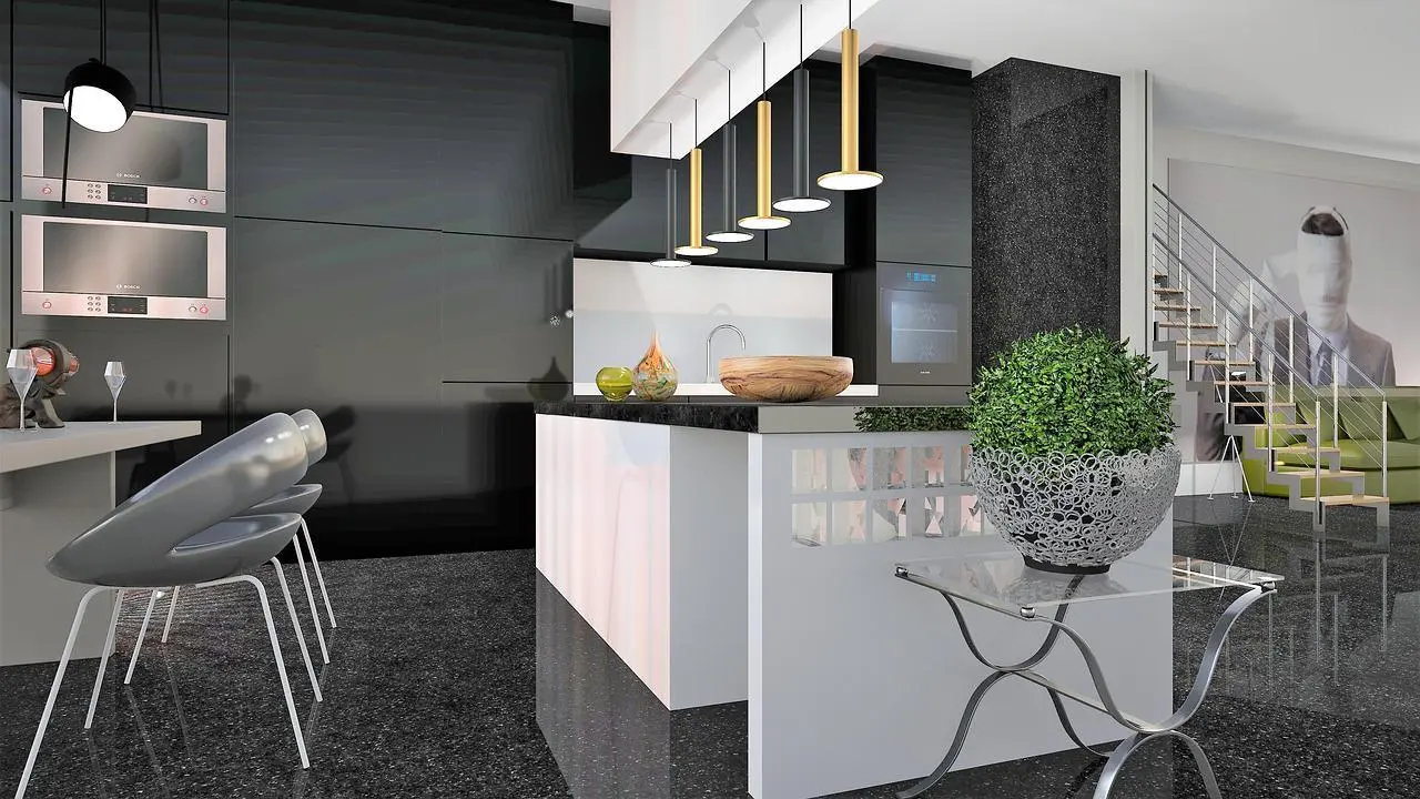 Black and white kitchen with a long island and grey designer chairs