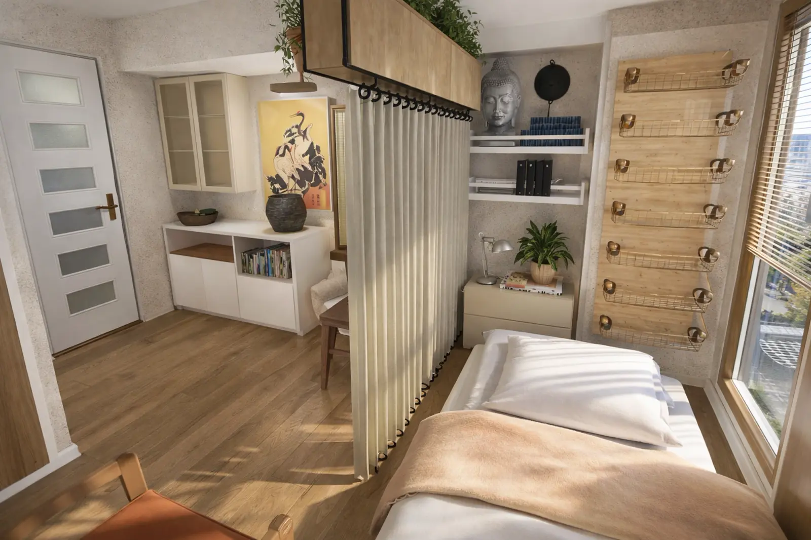 Estudio pequeño con una cortina entre la cama y la sala de estar y almacenamiento de pared